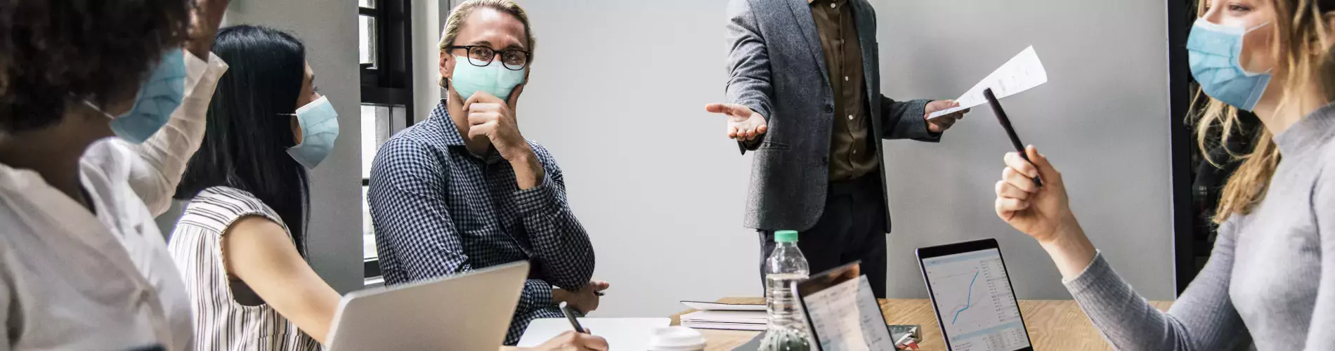 business-people-wearing-masks-in-coronavirus-meeting-the-new-normal